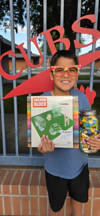 student with Lego kit