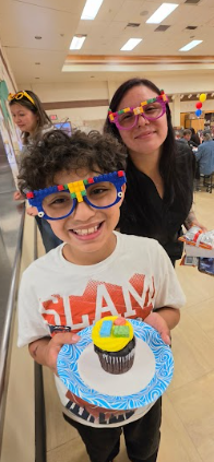 mom and son with cupcake