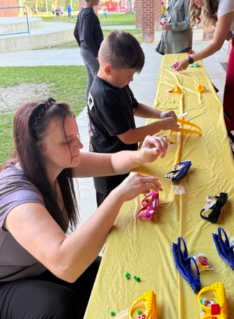 student and mom building glasses