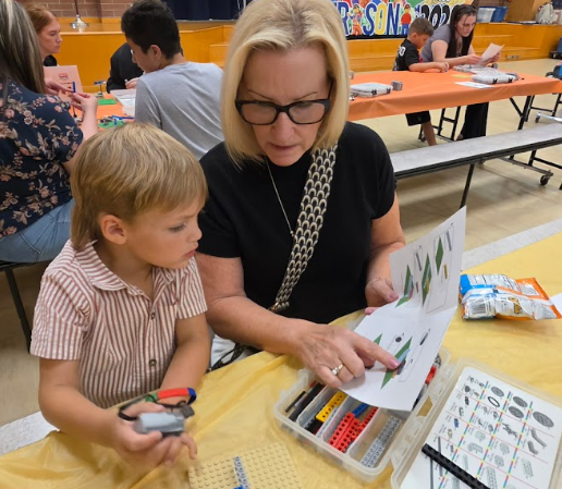 grandmother and son building a kit