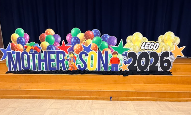 mother son 2026 sign with balloons