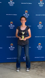 student with trophy
