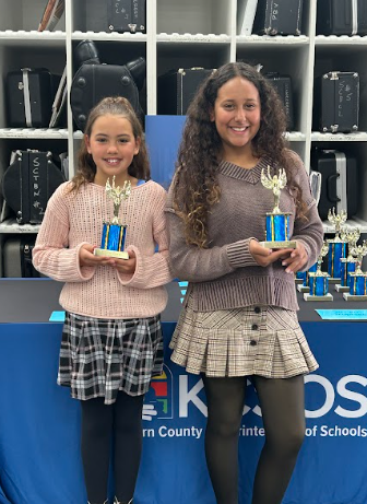 students with trophy