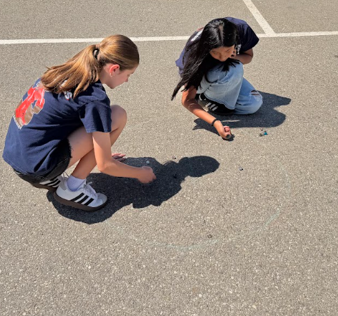students playing marbles