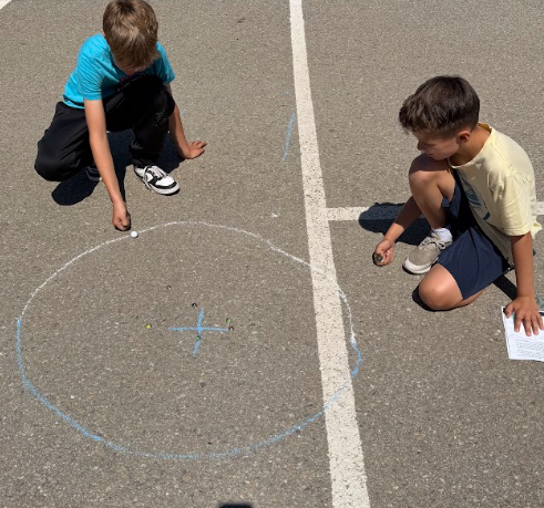 students playing marbles