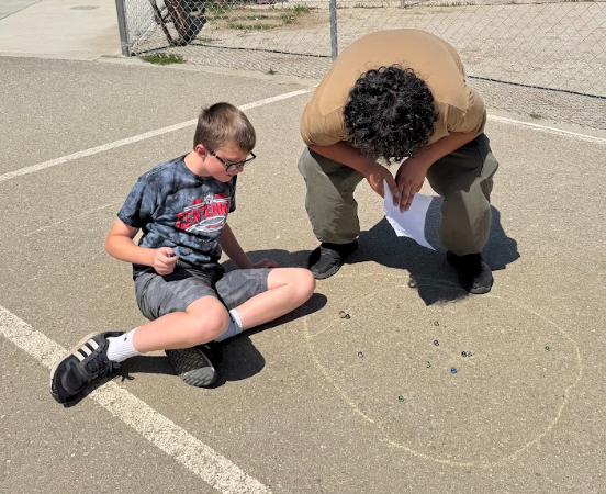 students playing marbles