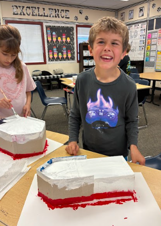 students working on making a model of the Titanic