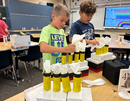 students working on making a model of the Titanic