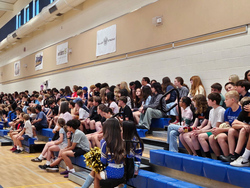 students sitting in bleachers