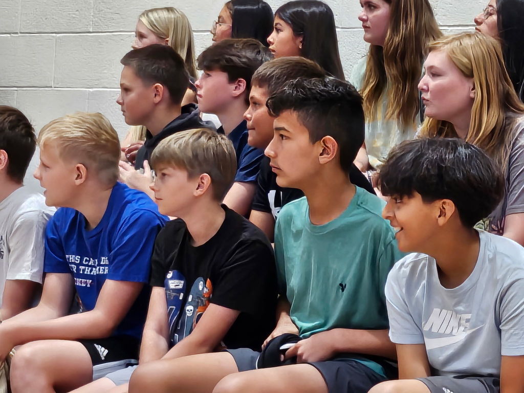 students sitting in bleachers