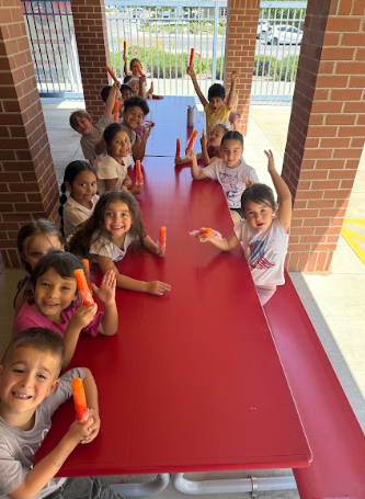 students with popsicles