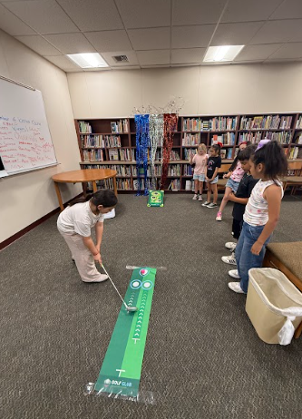 students playing putput golf