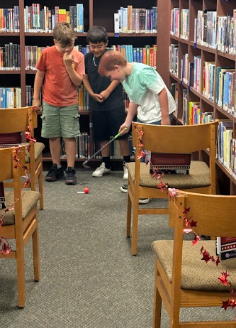 students playing mini golf