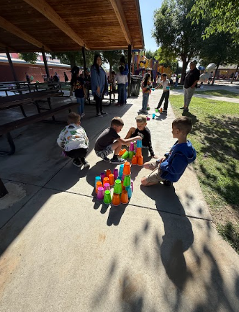 students playing cups