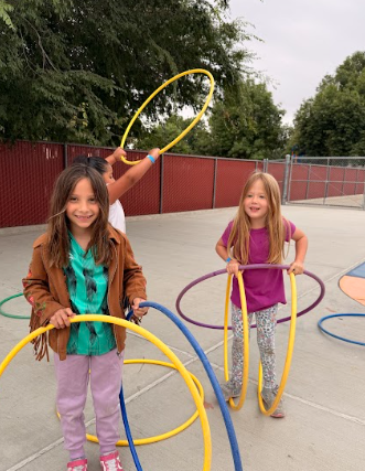 students with hoops outside