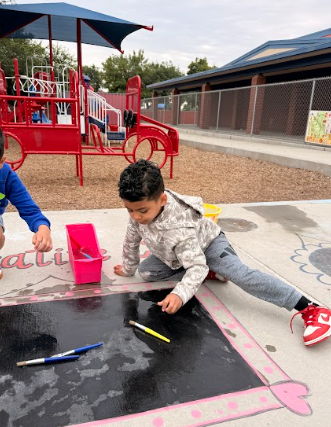 students painting with water