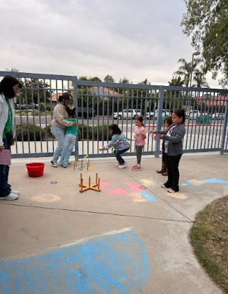 students with hoops outside