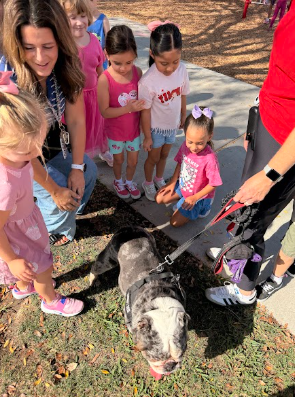 Ottis the dog and students