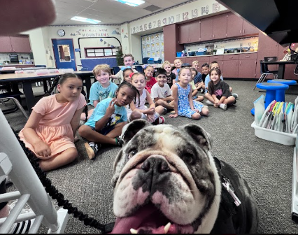 Ottis the dog and students