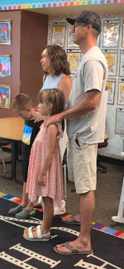 parents listening to a teacher's presentation