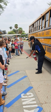 students standing outside the bus