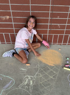 student with chalk art