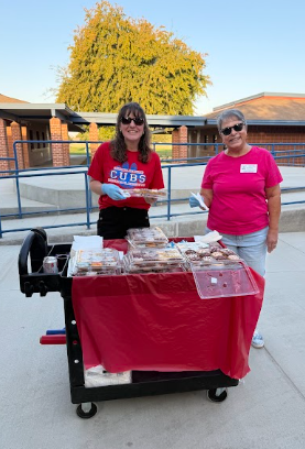 PTC volunteers passing out donuts