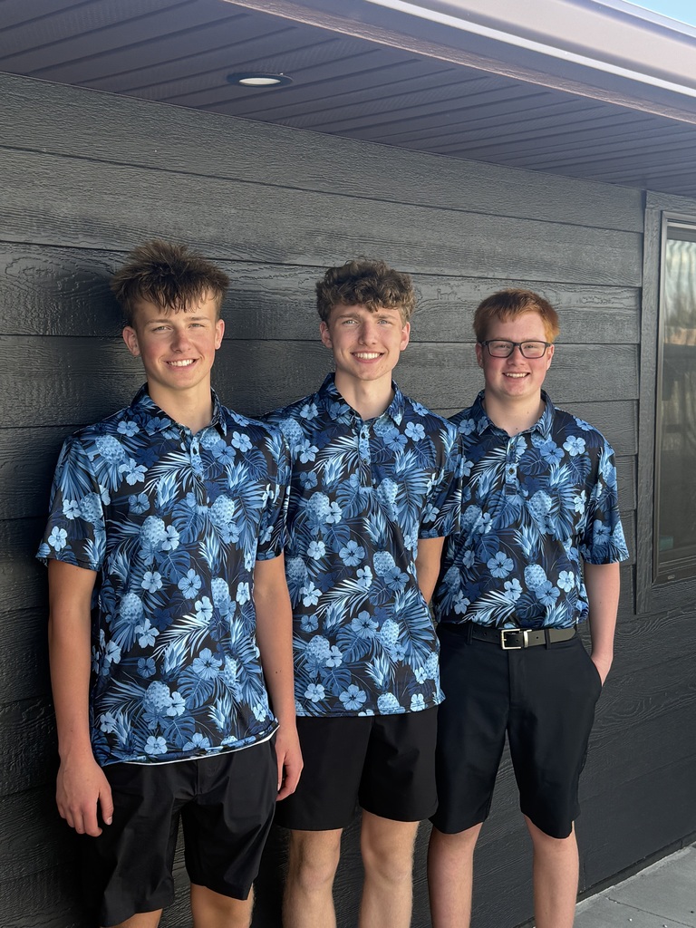 Jaxon, Mason, and Memphis in their golf uniforms.