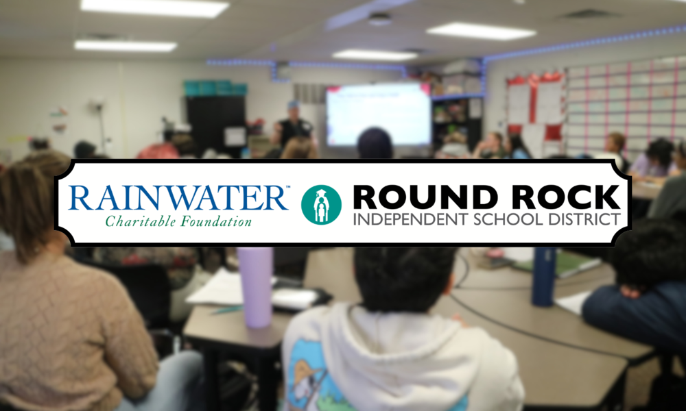 PHOTO OF CLASSROOM WITH RAINWATER X RRISD LOGO
