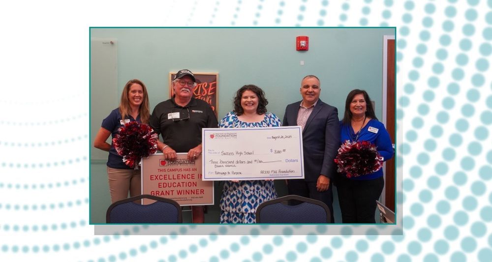 Pie grant being given at Success HS