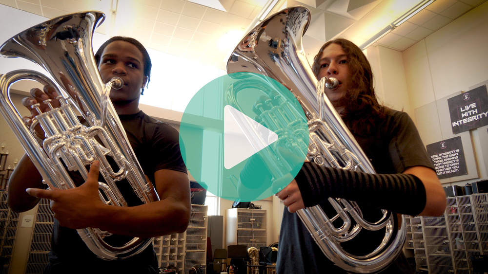 Image of two band students playing instruments