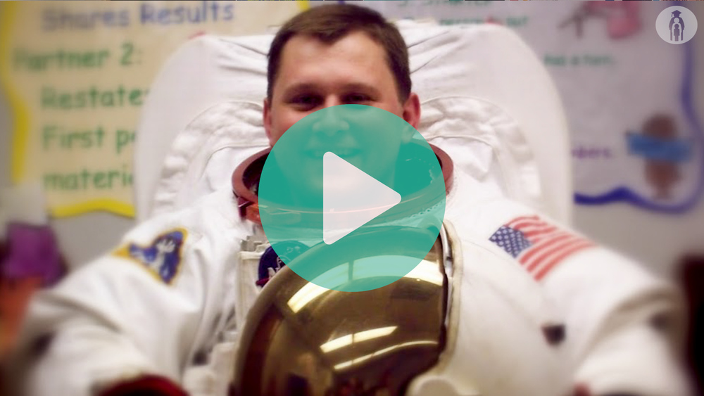 Picture of Mathew Bartley science teacher at Cedar Valley MS in an astronaut suit.