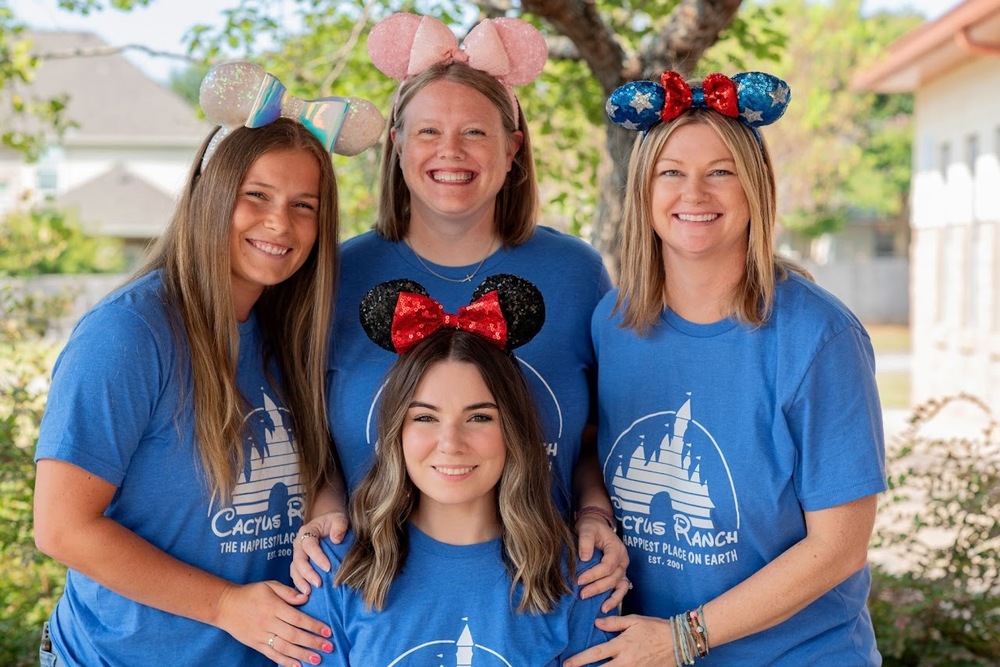 Cactus Ranch Elementary Kindergarten Teachers pose for a picture with Mickey Mouse ears on
