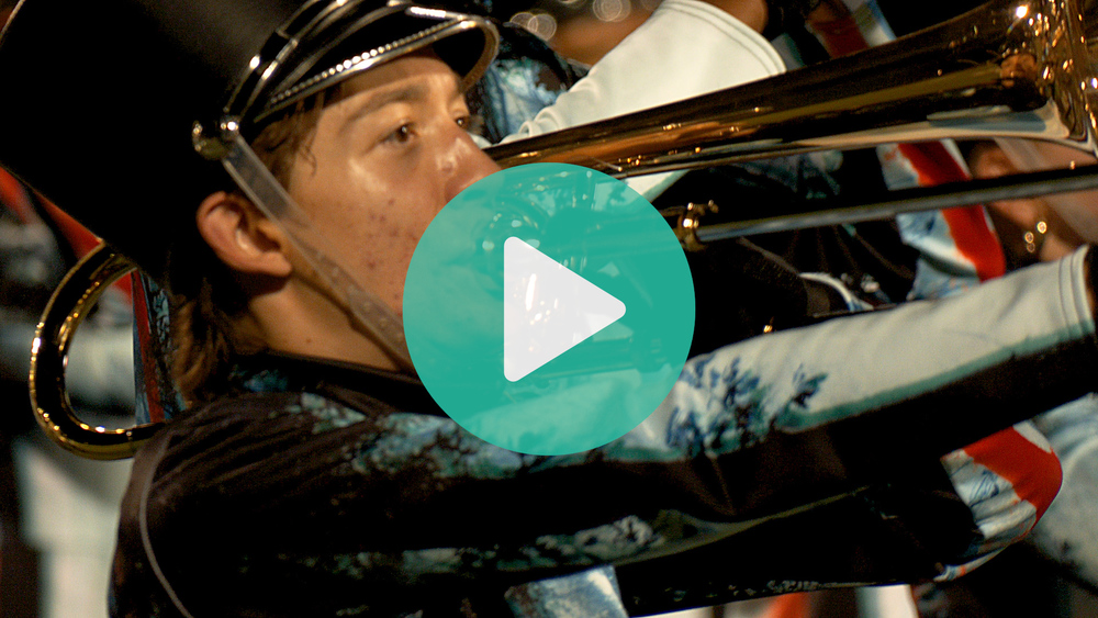 Picture of Westwood High School marching band student playing the trombone