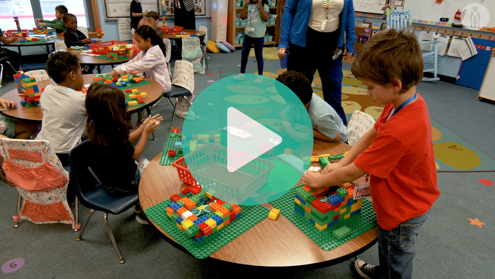Picture of enrichment Friday classroom with students working with Legos