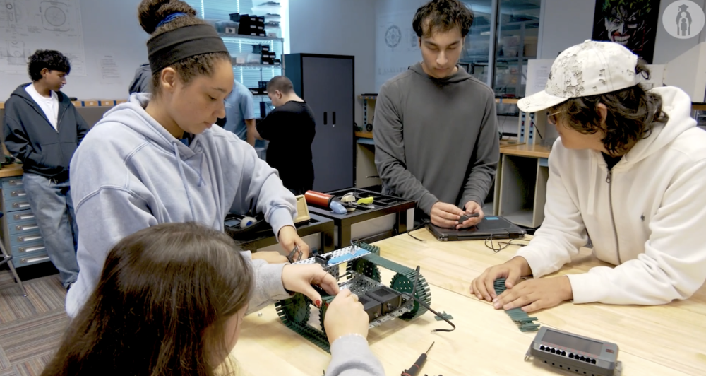 Picture of students working on a robot