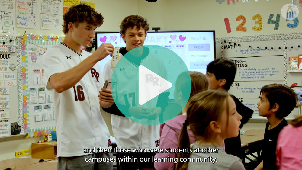 picture of baseball player holding up math card for student to guess right answer