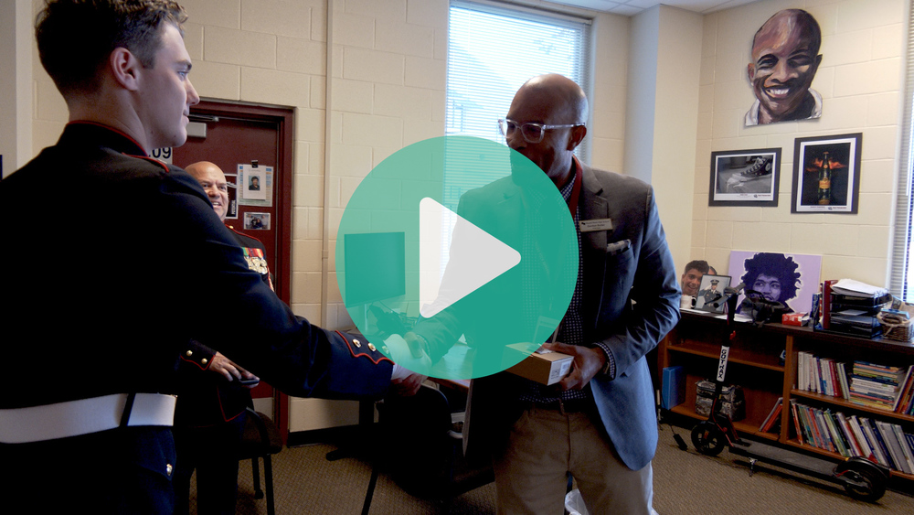 Round Rock HS JROTC cadet shaking hands with Round Rock HS principal