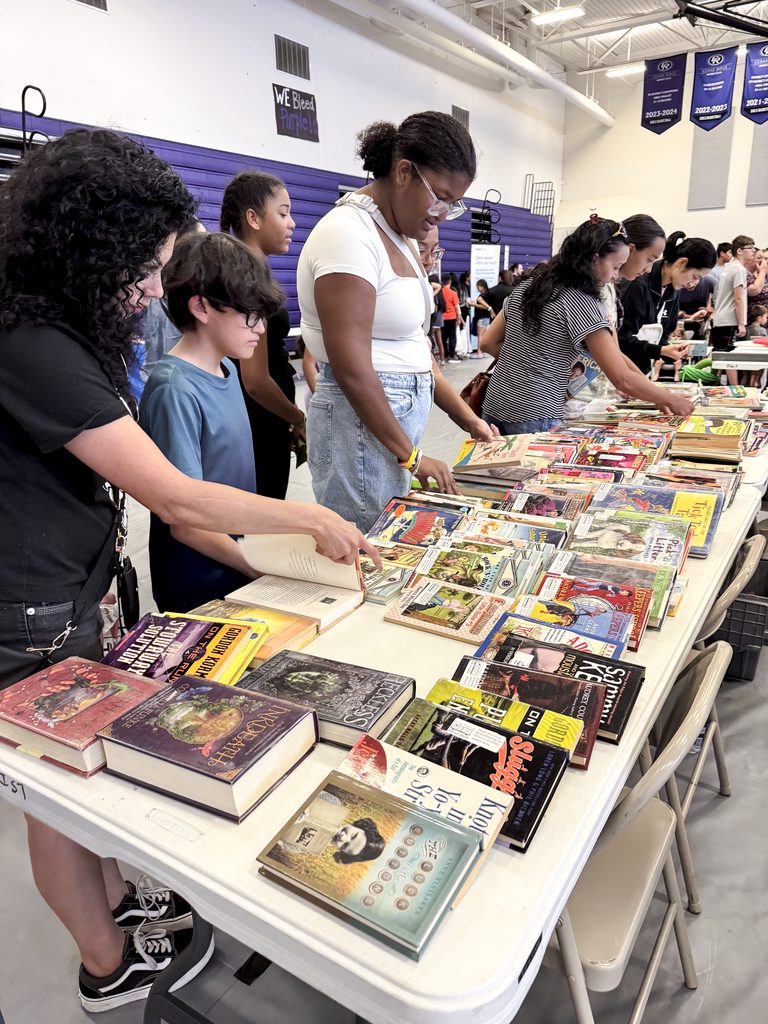 Students at the Library booth getting free books.