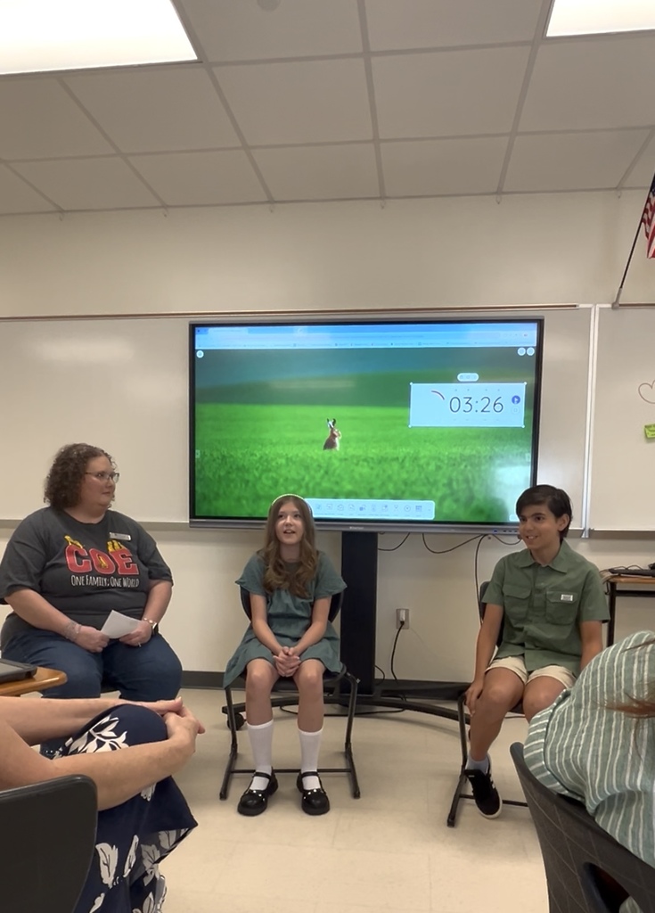 Two Chanlder Oaks Students and our IB coordinator presenting