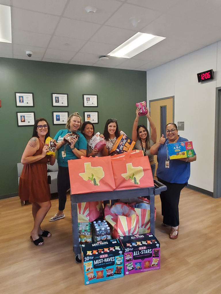 staff holding snacks