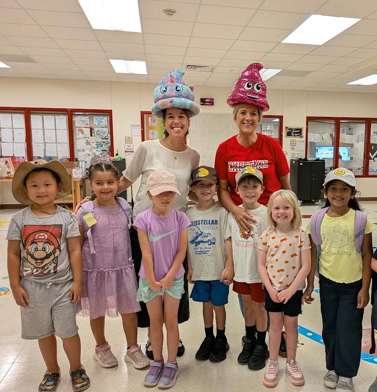Kindergarten students and the Principal and Assistant Prinicipal wearing hats for Hat Day