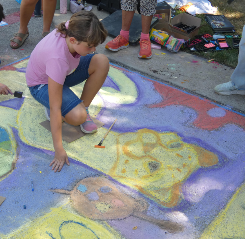 Students creating chalk art