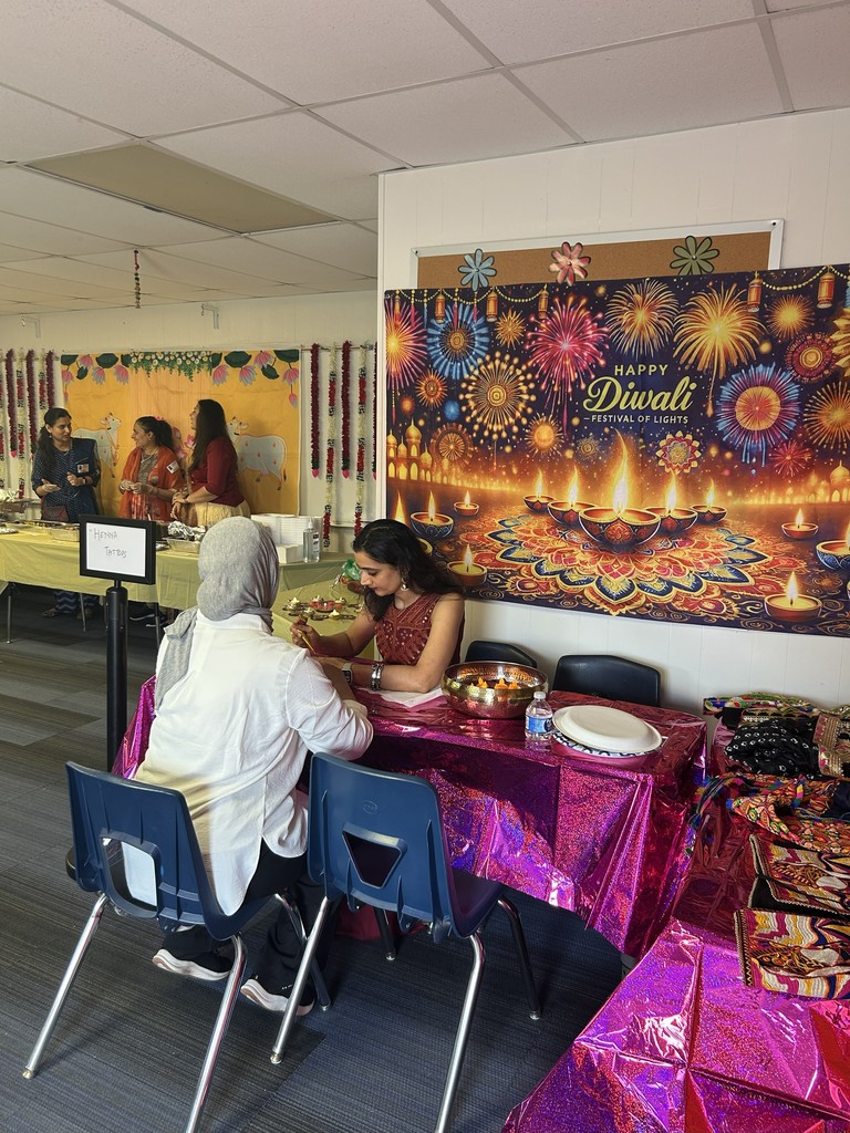 Staff getting Henna designs.