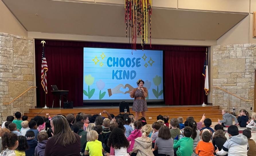 Picture of students watching screen for "Hey Dude, Nice Shoes" Presentation
