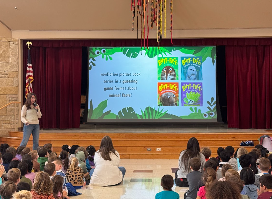 Picture of students looking at screen with "Butt or Face" books