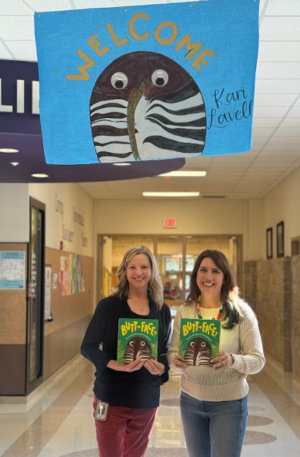 Ms. Collings and author Kari Lavelle standing holding the book "Butt or Face"
