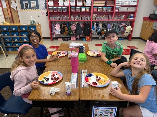Students enjoying a Greek-themed snack.
