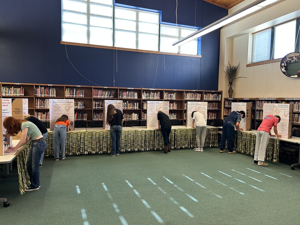 Students voting at the booths.