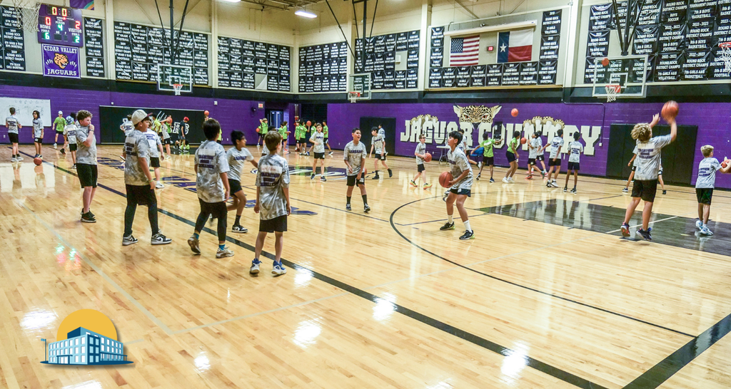 Students playing basketball with the 2024 Bond logo